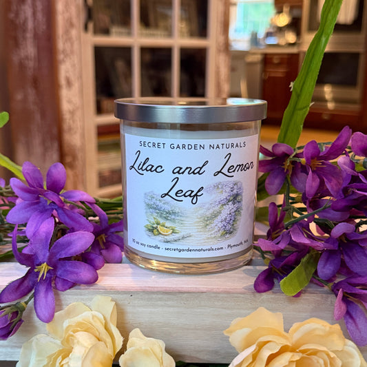 Canister labeled 'Lilac and Lemon Leaf' with purple and yellow flowers on a wooden surface.