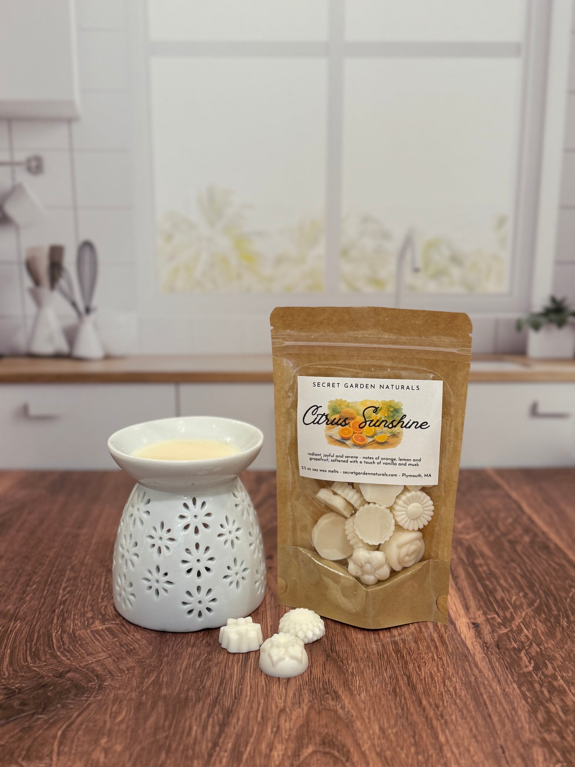 Wax melter  with 'Citrus Sunshine' wax melts on a wooden surface.