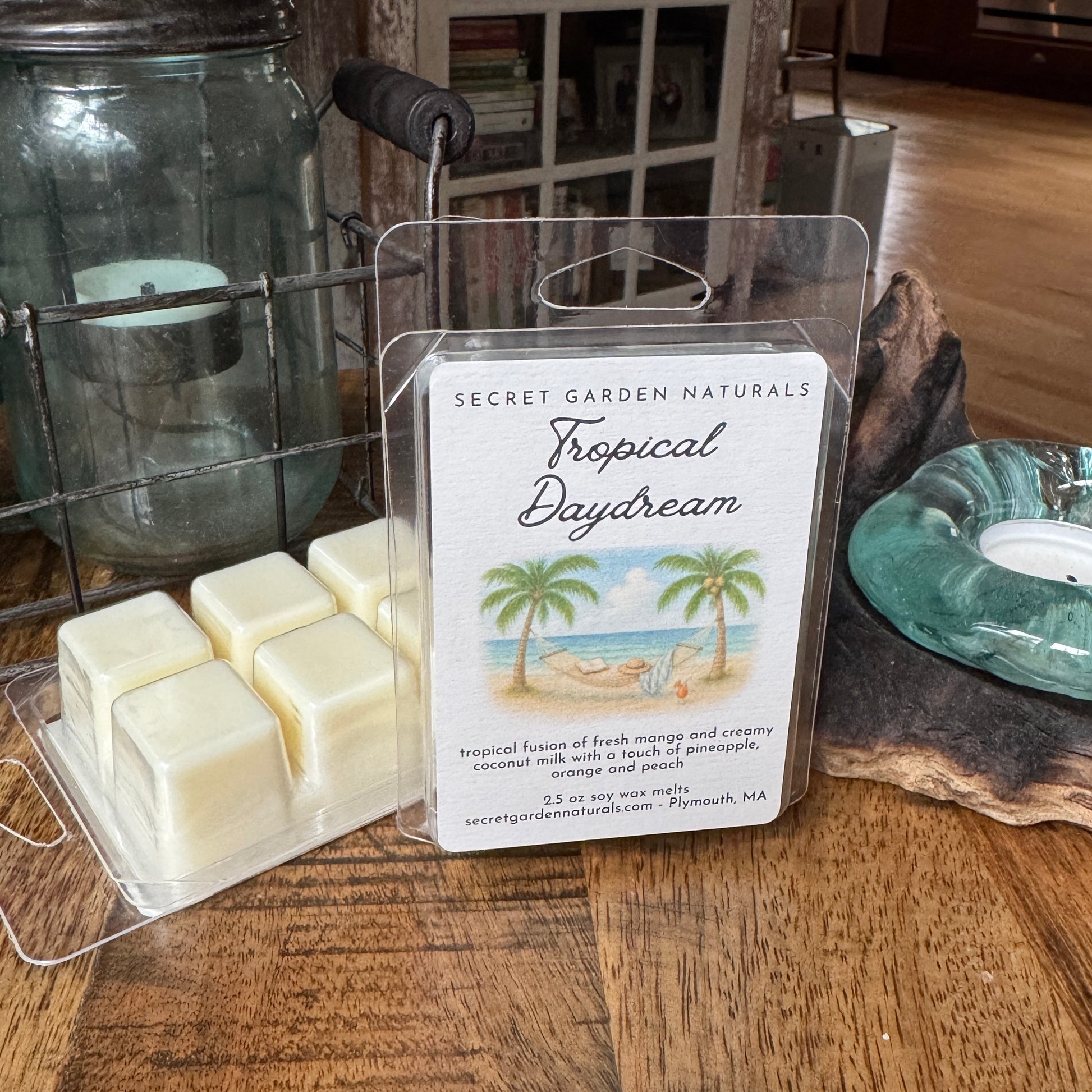 Packages of Tropical Daydream wax melts, on a wooden table.