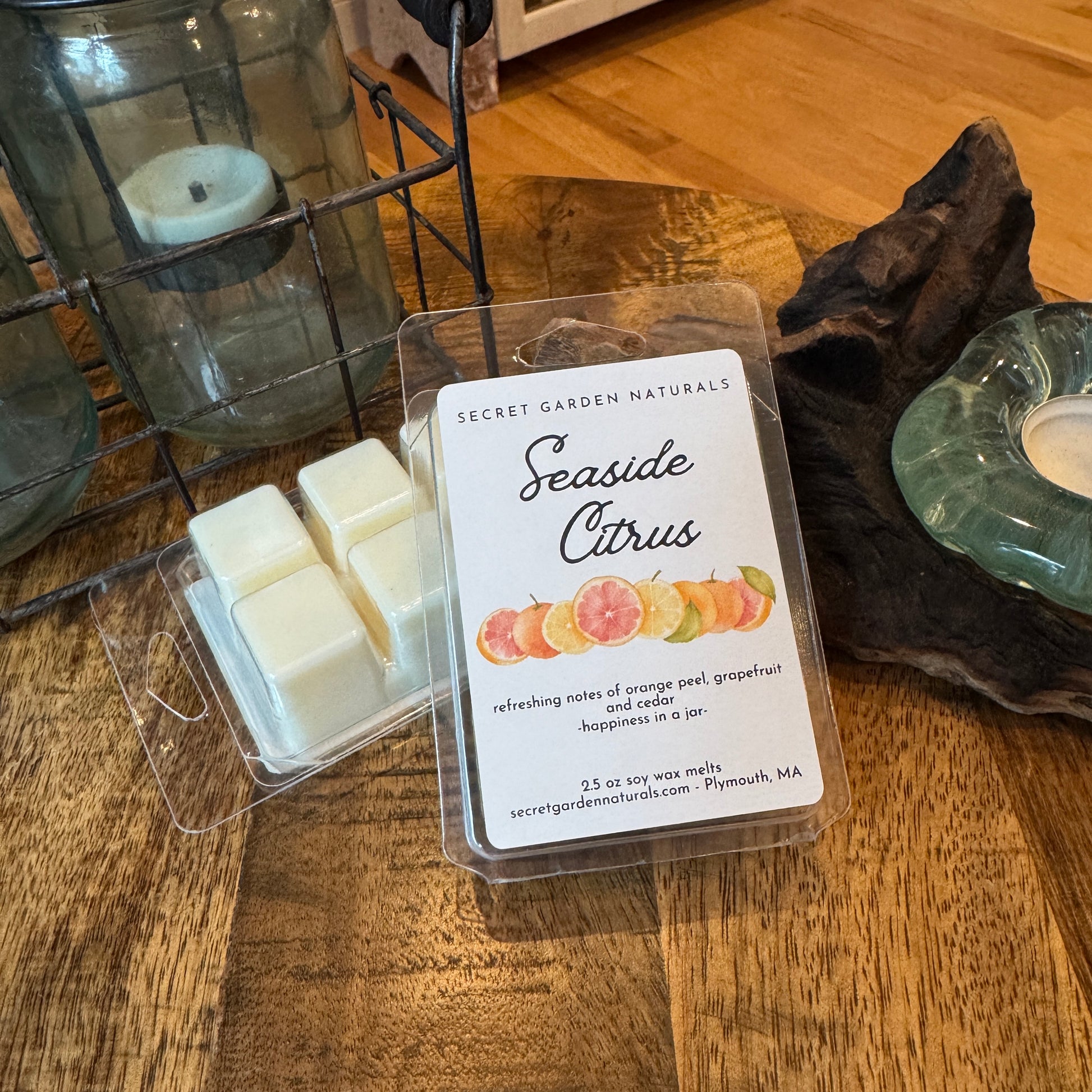 2 packages of Seaside Citrus wax melts on a wooden table